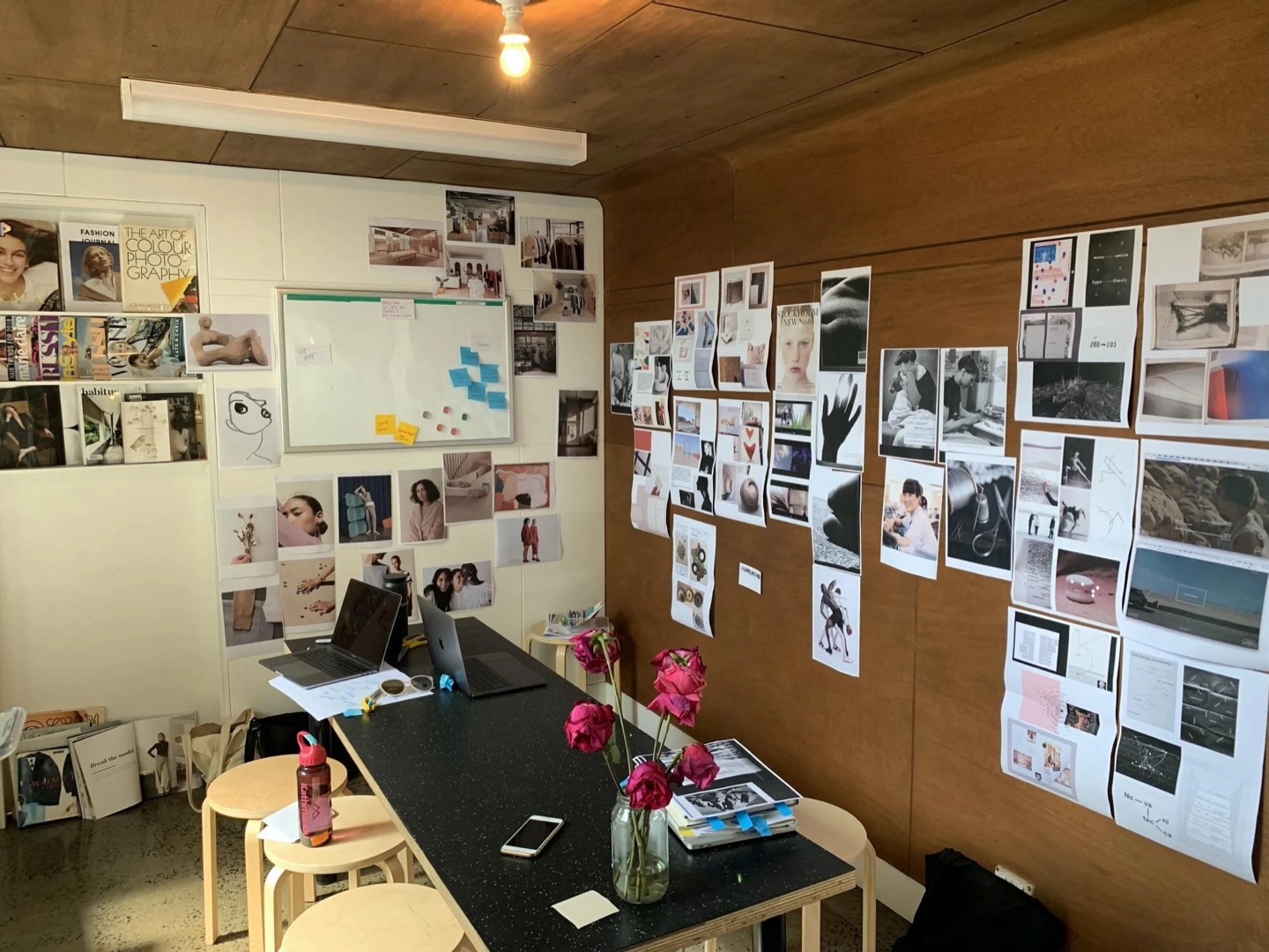 Arnsdorf studio meeting room with fashion photography and inspiration pinned across the walls