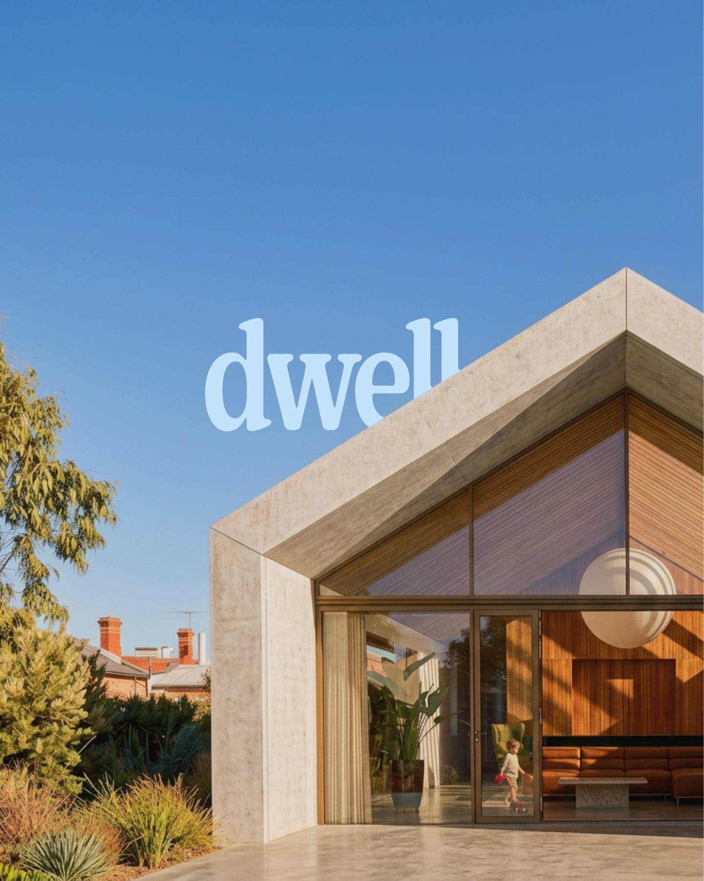 Dwell logo in pale blue over a modern concrete-and-glass home with a child playing inside