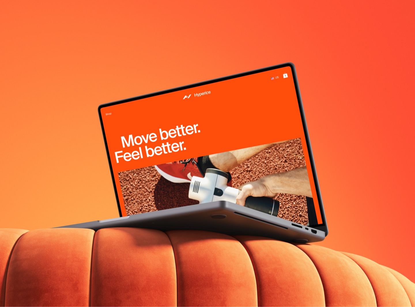 Laptop on an orange velvet sofa showing the Hyperice homepage: Move better. Feel better.