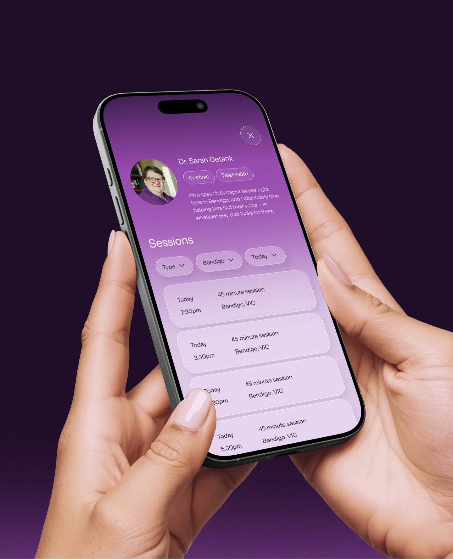 Hands holding a phone showing a speech therapist's profile and bookable sessions in the Kismet app