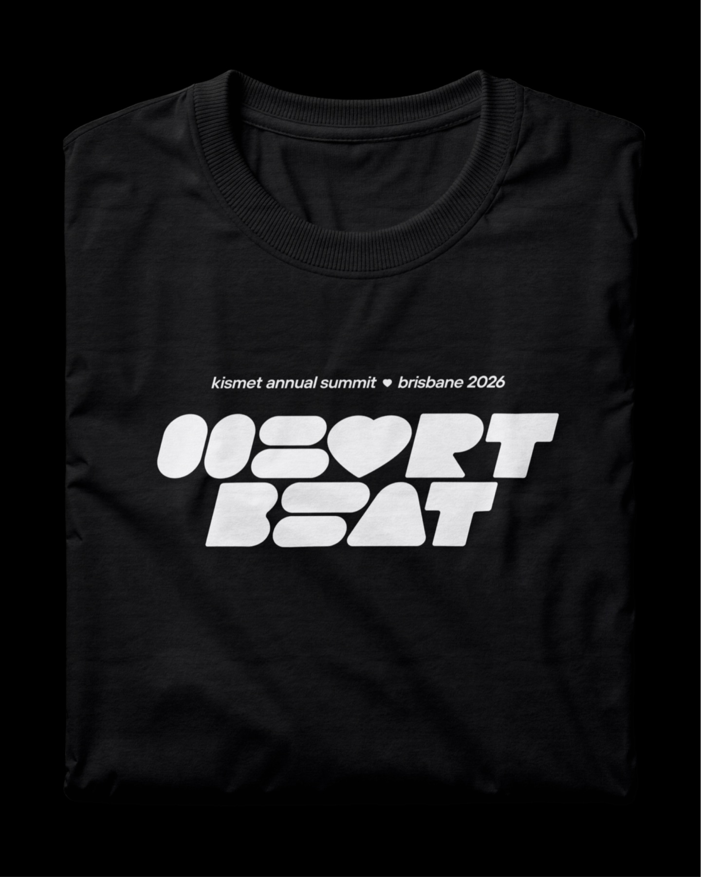 Folded black T-shirt printed with the Heartbeat logo: Kismet annual summit, Brisbane 2026